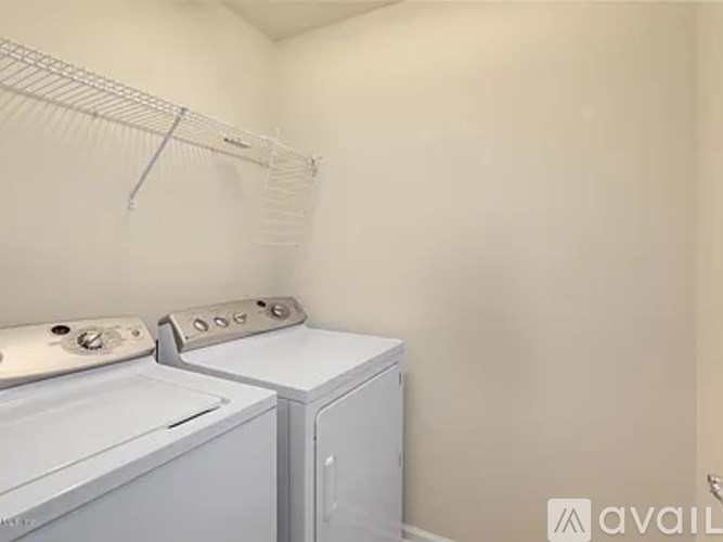 A laundry room with a washer and dryer.