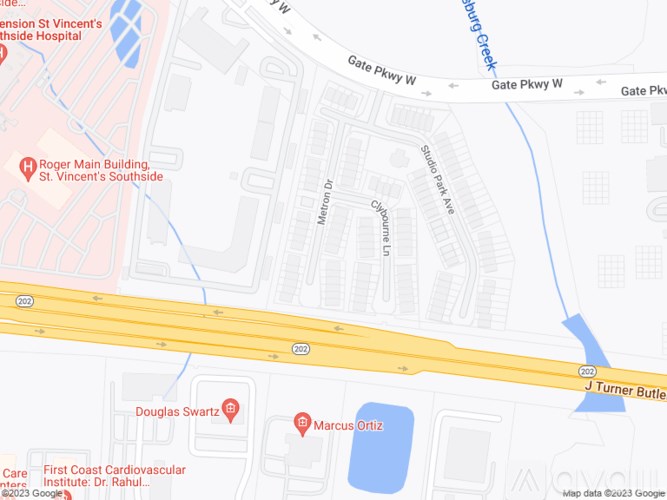 A map shows a section of a city with streets, buildings, and a highway.