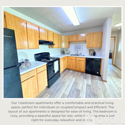 A kitchen with wooden cabinets and black appliances.