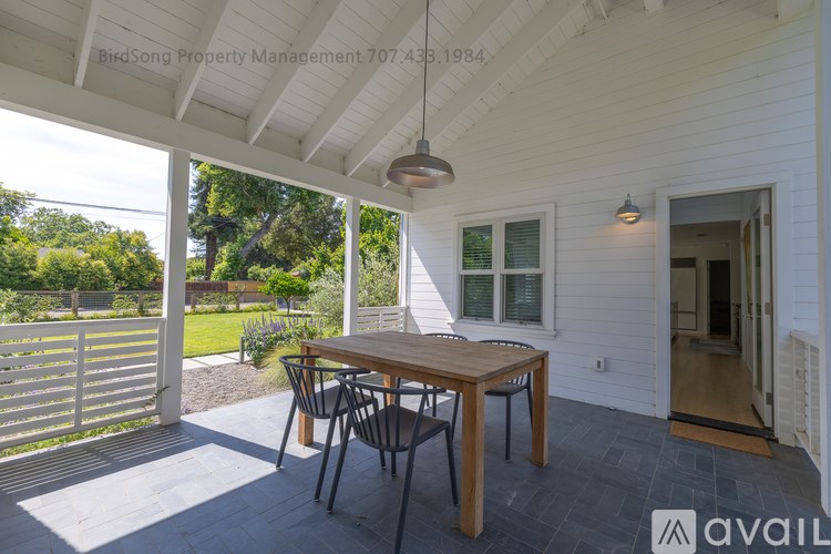A patio with a table and chairs is shown in the image.
