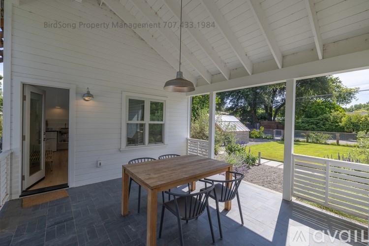 A patio with a table and chairs is shown.