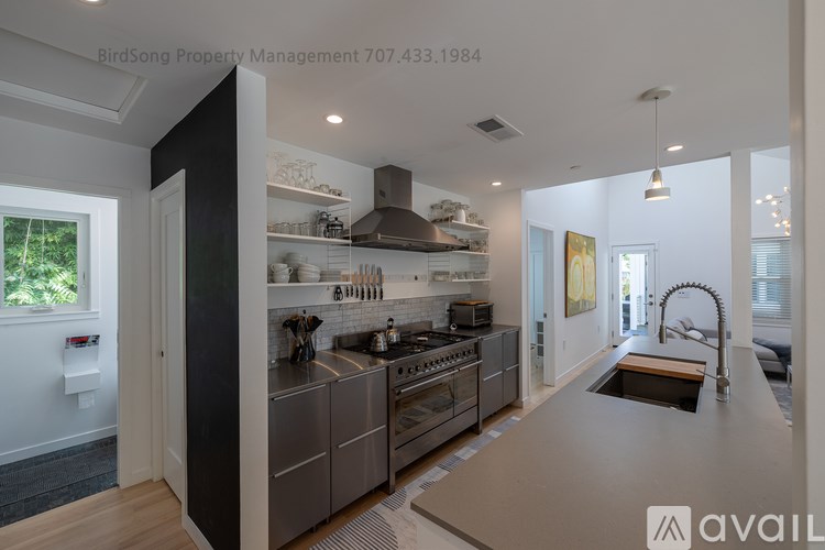 A modern kitchen with a large island in the middle.