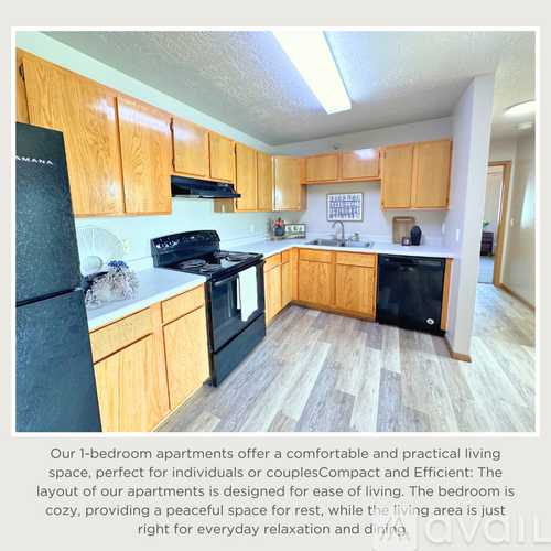 A kitchen with wooden cabinets and black appliances.