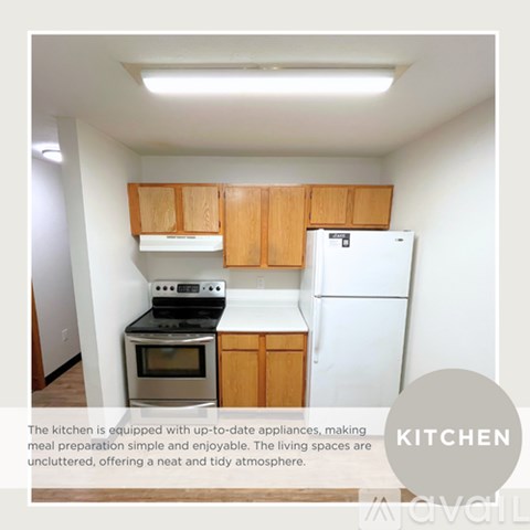 A kitchen with wooden cabinets and white appliances.