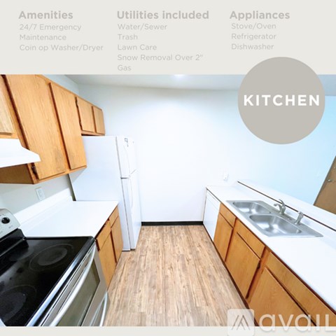 A kitchen with wooden cabinets and a stove top oven.