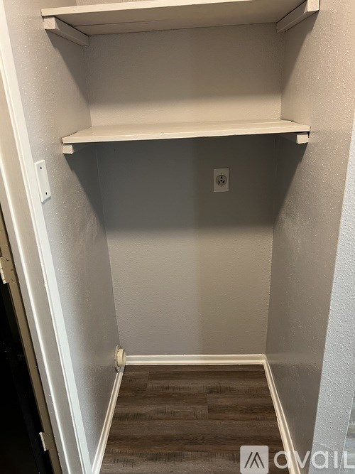 Empty white shelves in a room.
