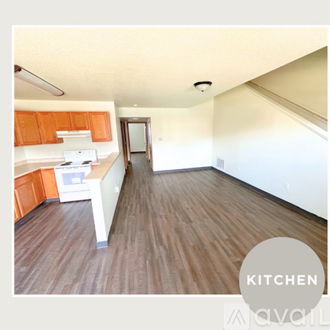 A kitchen with wooden floors and orange cabinets is available.