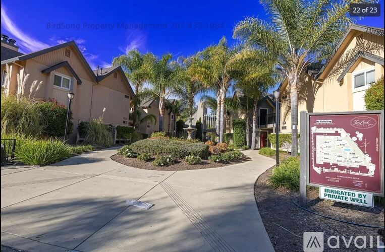 A sunny day at Birdsong Property Management with a sign indicating the community is private.