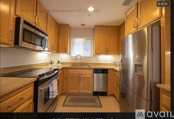 A kitchen with wooden cabinets and stainless steel appliances.