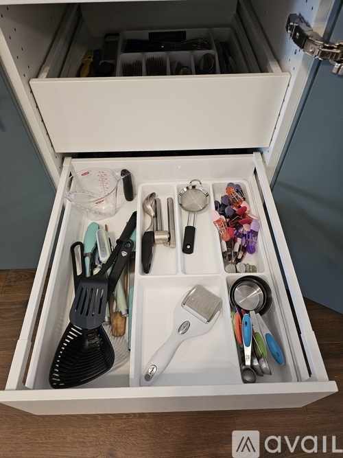 A drawer full of kitchen utensils and appliances.