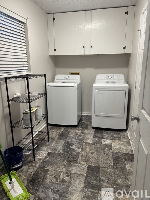 A laundry room with a washer and dryer.