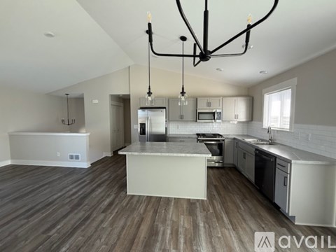 A modern kitchen with a large island in the middle.