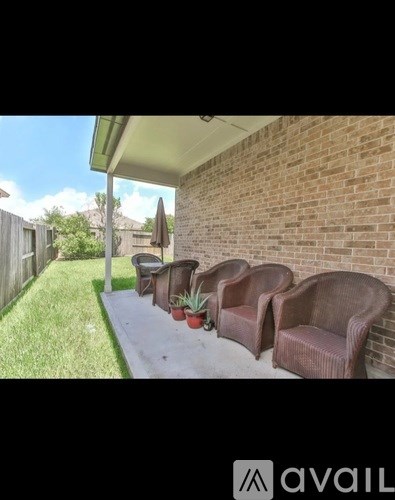 A patio with chairs and a table is available for rent.