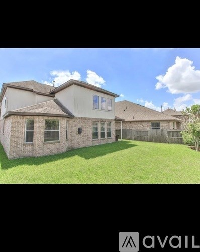 A house with a lawn in front of it.