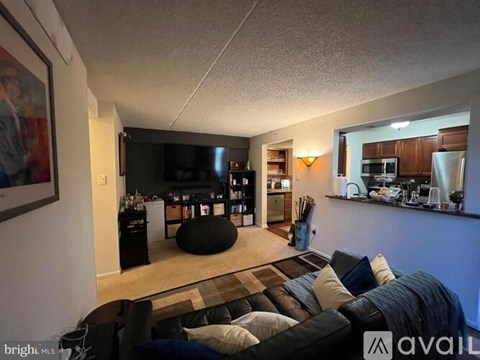 A living room with a couch and a television.