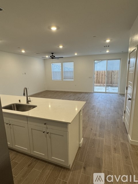 A kitchen with a sink and cabinets.