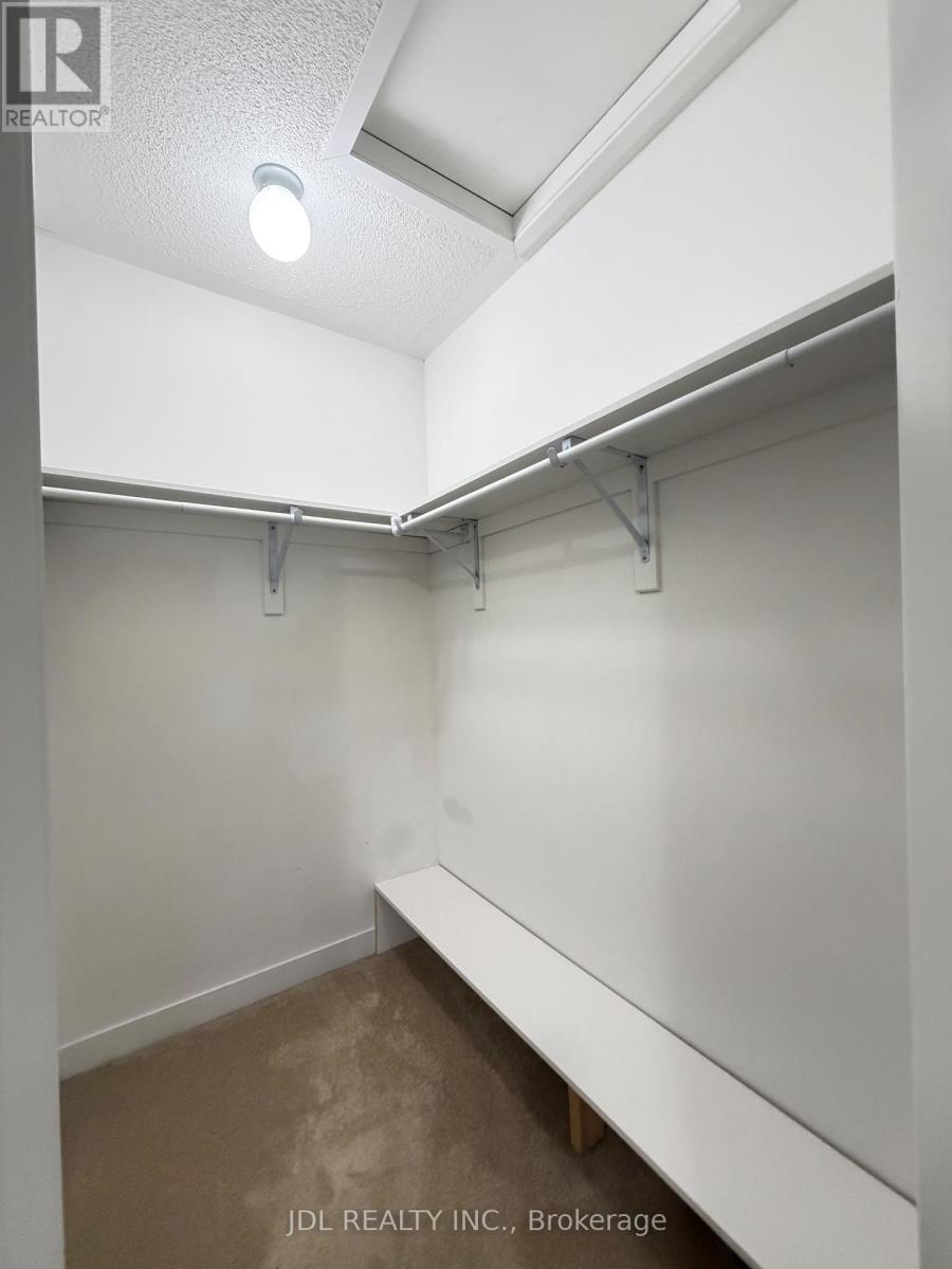 A brokerage office with a white bench and a light on the ceiling.