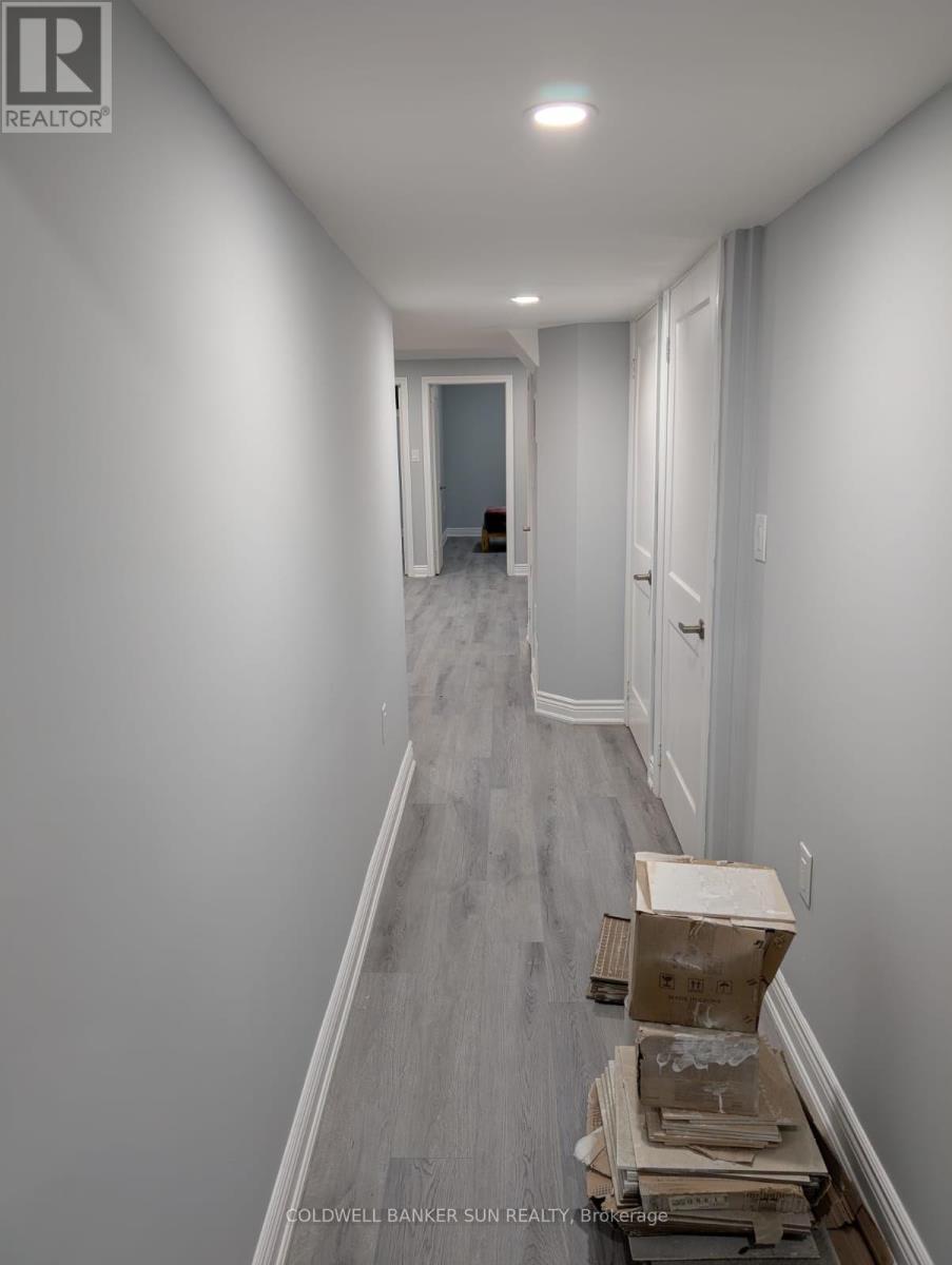 A long, narrow hallway with a box on the floor.