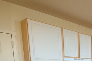 kitchen with wooden and white cabinets and open layout - Photo Gallery 5