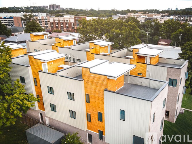 A large building complex with orange and white exterior.