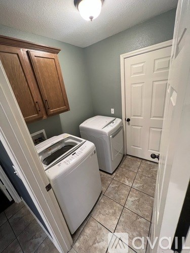 A laundry room with a washer and dryer.