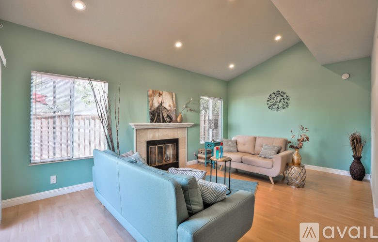 A living room with a fireplace and a couch.
