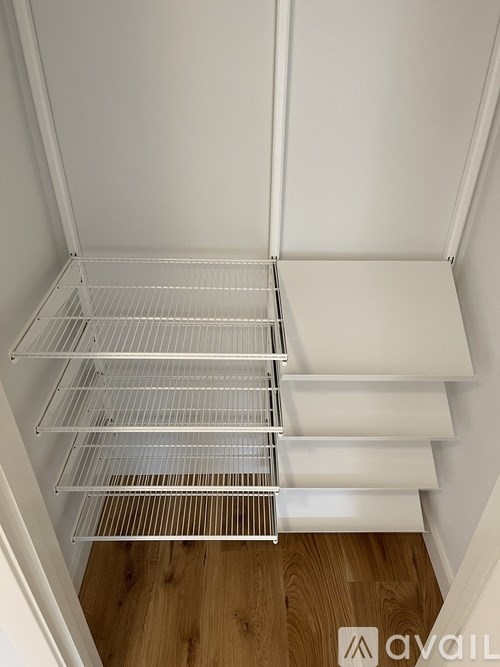 Empty white shelves in a kitchen.