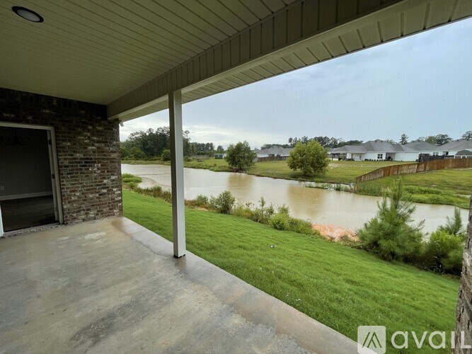 A house with a balcony overlooking a flooded area.