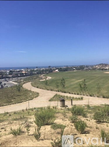 A view of a landscape with a road winding through it.
