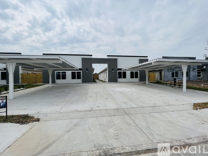 A row of houses with the first one being for sale.