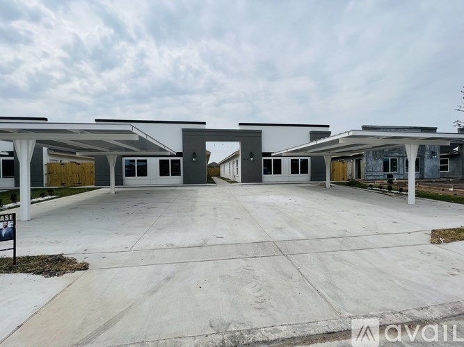 A row of houses with the first one being for sale.