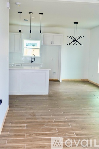 A kitchen with a sink and a window.