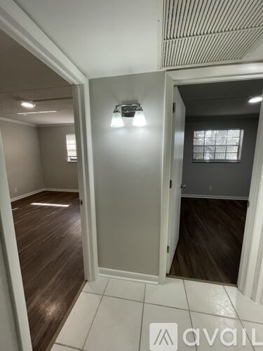 A room with a doorway leading to another room.