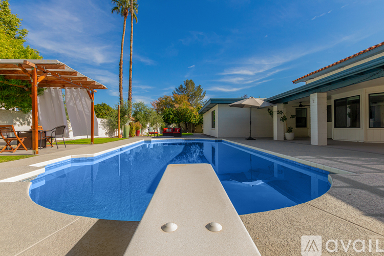 A pool with a white bench in the middle of it.