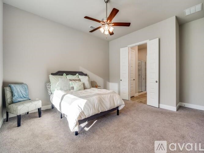 A house with a grey roof and a black door.