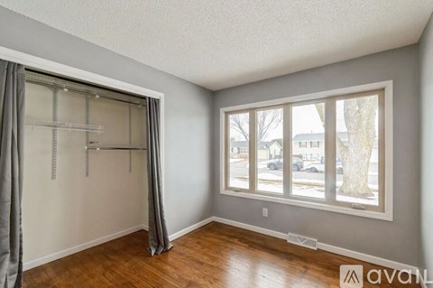 A room with a sliding door and a window.