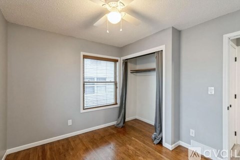 A room with a window and a door.