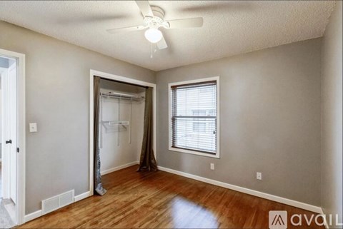 A room with a sliding door and a window.