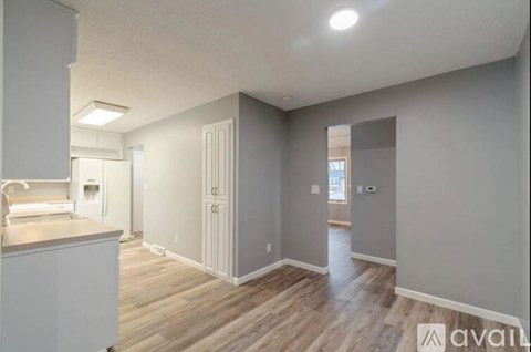 A kitchen area with a counter and cabinets.