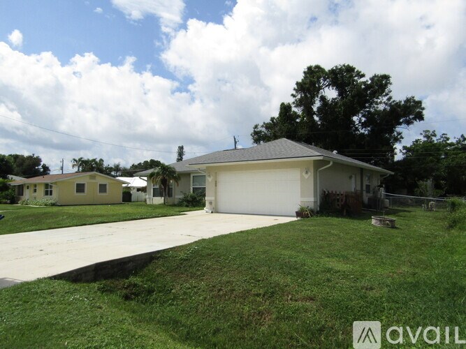 A house with a garage is for sale.