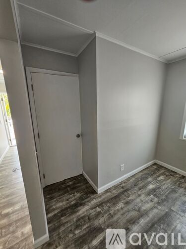 A room with a door and a window.