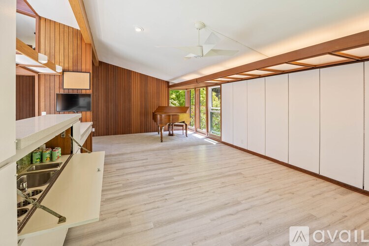 A kitchen with wooden cabinets and a white countertop.