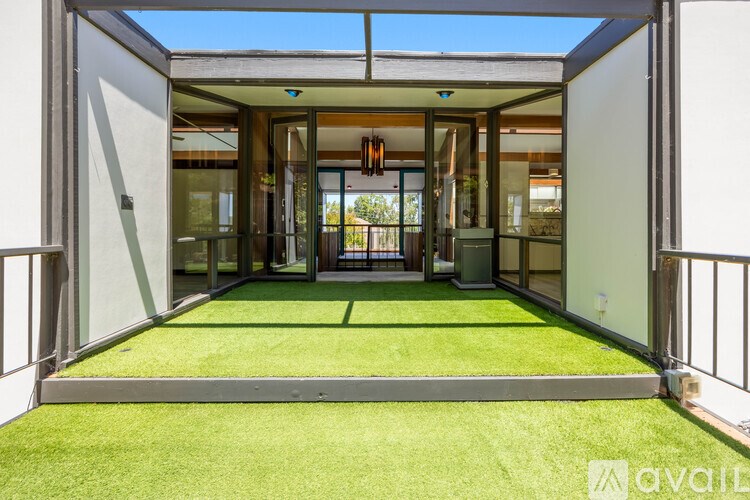 A modern house with a glass door entrance.