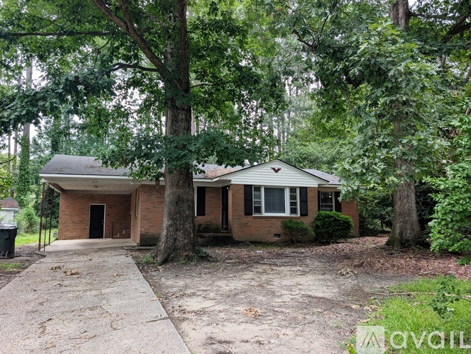 A house with a tree in front of it.