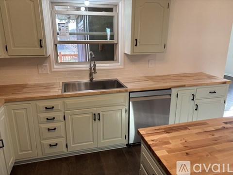 A kitchen with a sink and a window.