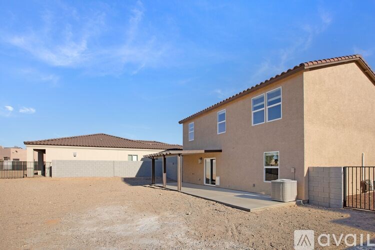 A house with a brown roof and beige walls is available for sale.