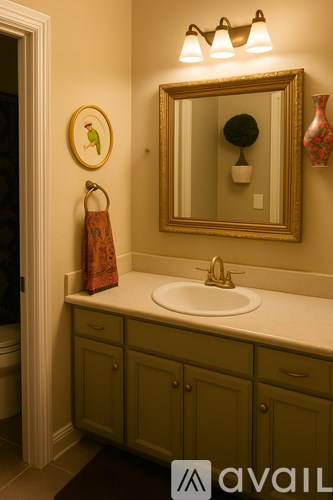 A bathroom with a sink and a mirror.