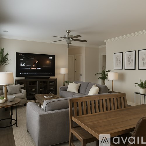 A living room with a television and a couch.