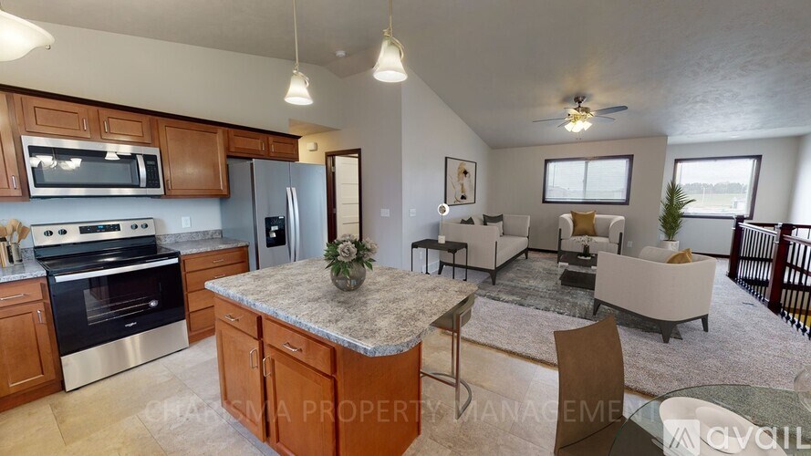 A kitchen with wooden cabinets and granite countertops.