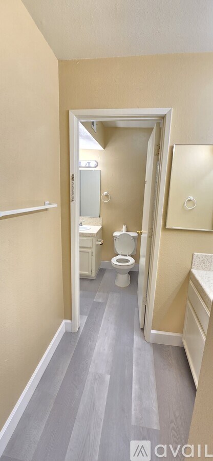 A bathroom with a toilet and a sink.